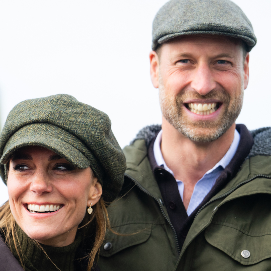 Princess Kate and Prince William smiling and wearing flat caps