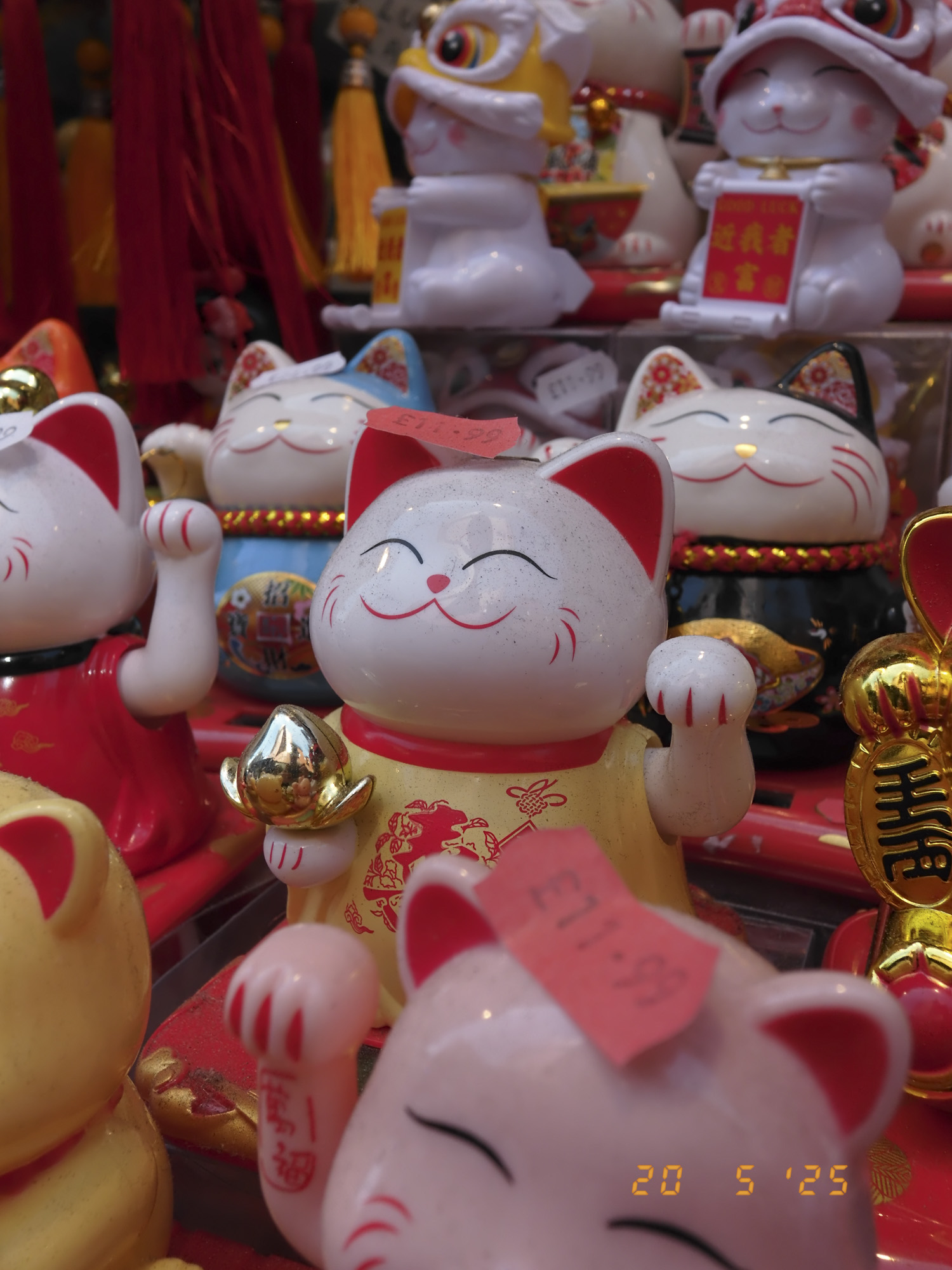 Closeup of maneki-neko in London's china town