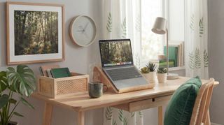 IKEA home office setup with natural wood and green accessories