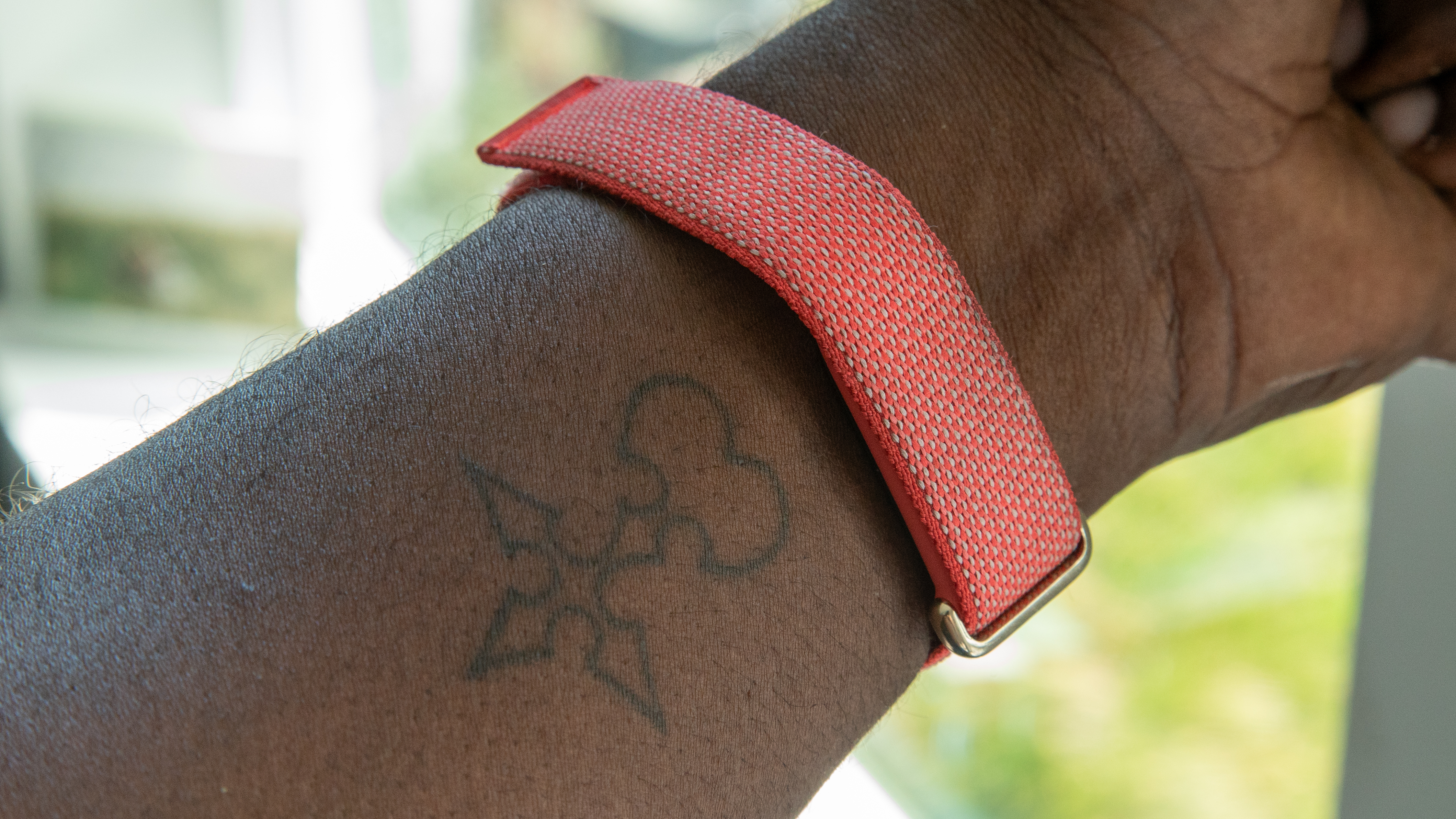 Google Fitbit Air band with an analogue watch