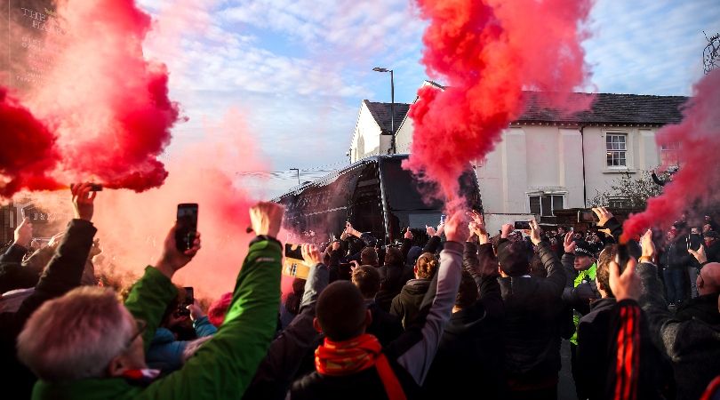 Liverpool fans let off flares and smoke bombs as the team buses arrive ahead of the Reds&#039; Premier League game against Manchester United at Anfield in December 2023.