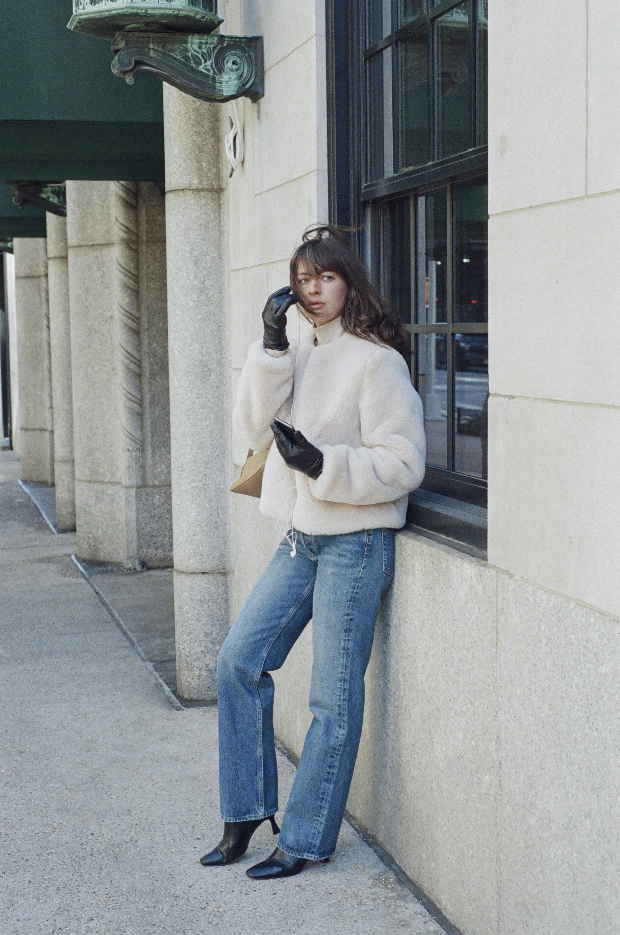 Kathryn Zahorak wearing fur jacket, jeans, boots