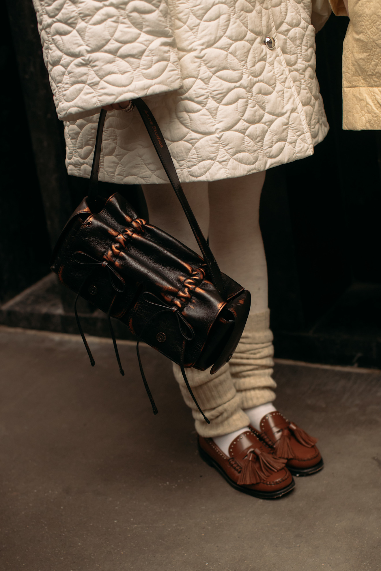 woman wearing tasseled loafers in New York.