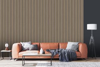 Slat effect wallpaper in 70s-inspired lounge with leather couch, gray cushioning and large area rug