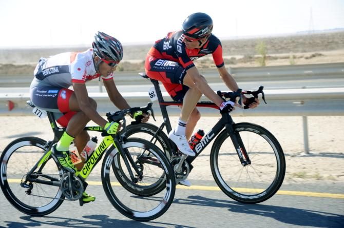 Two riders consult during the final stage