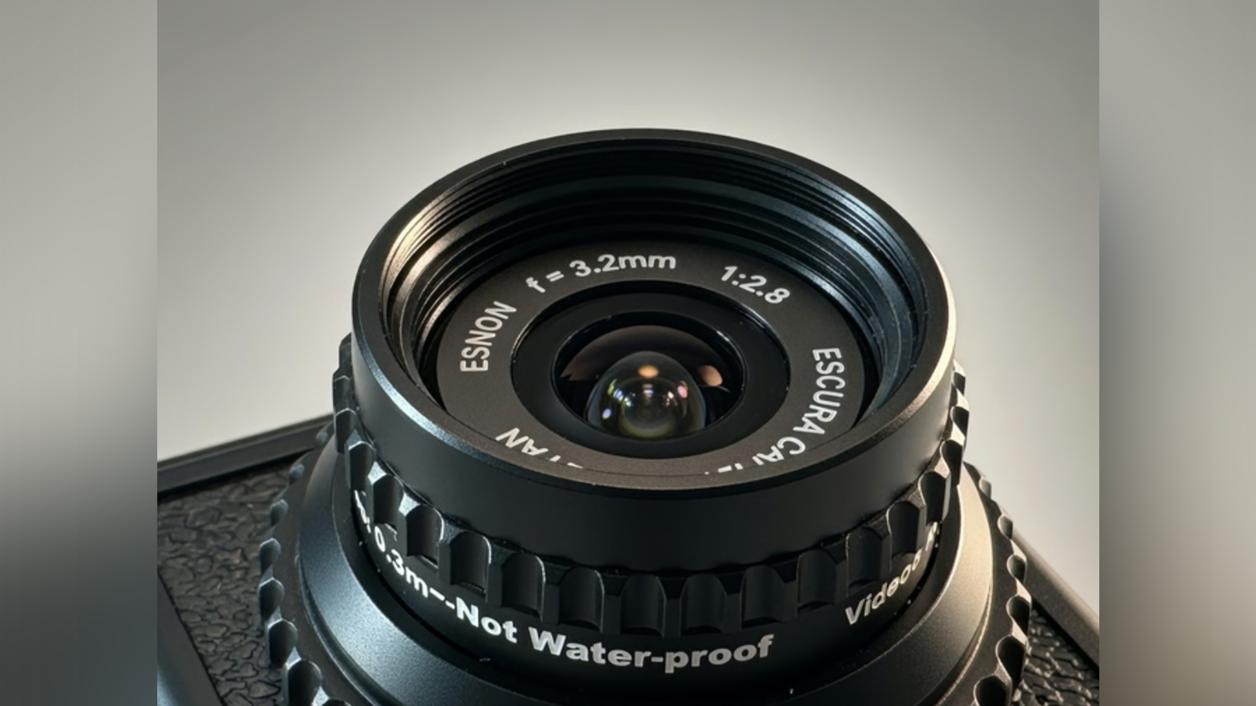 A closeup of a black camera lens.