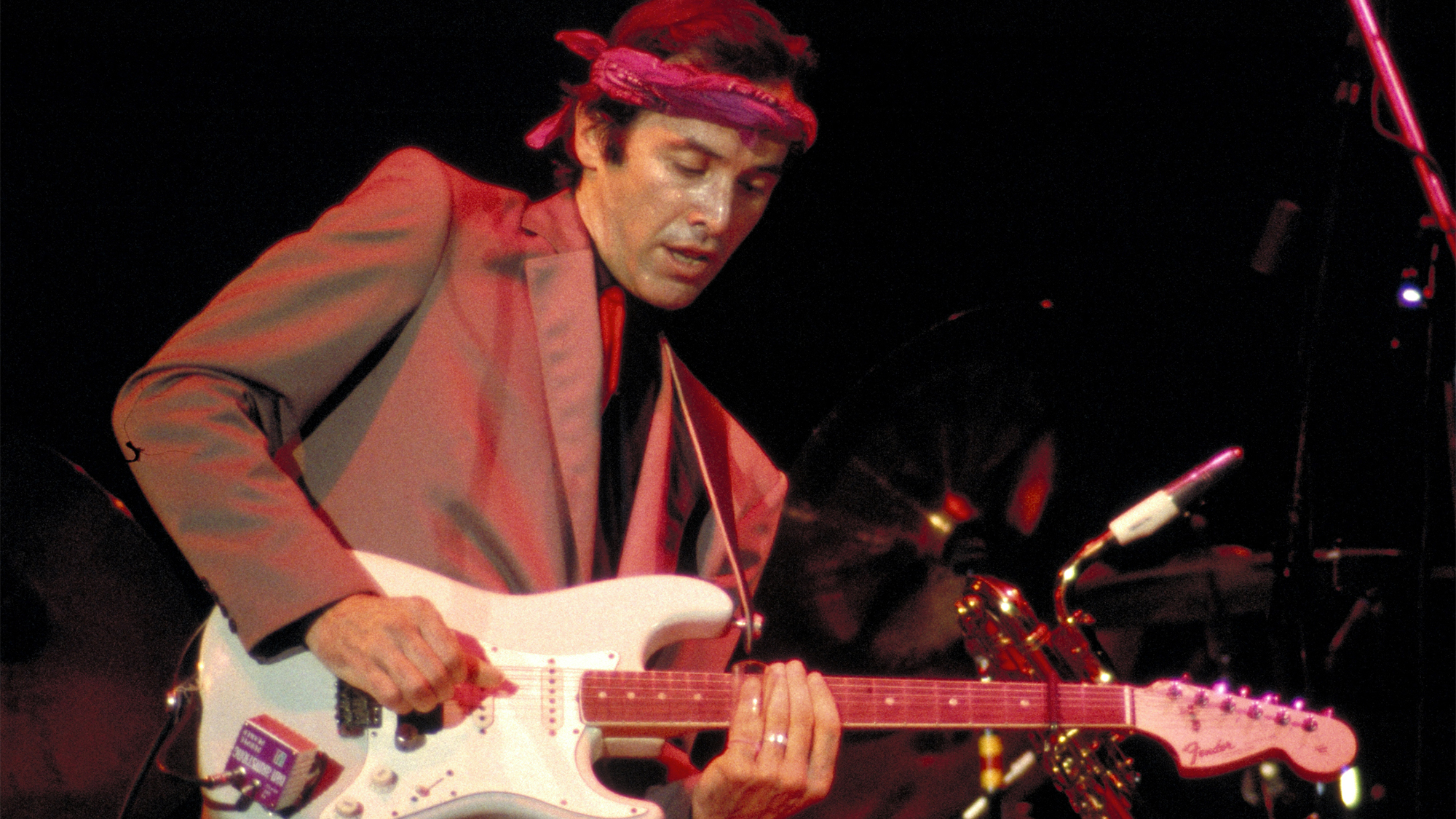 Ry Cooder performing with his band (opening for Eric Clapton) at the Cow Palace in San Franciso on February 7, 1983. He plays slide guitar on a Fender Stratocaster. (