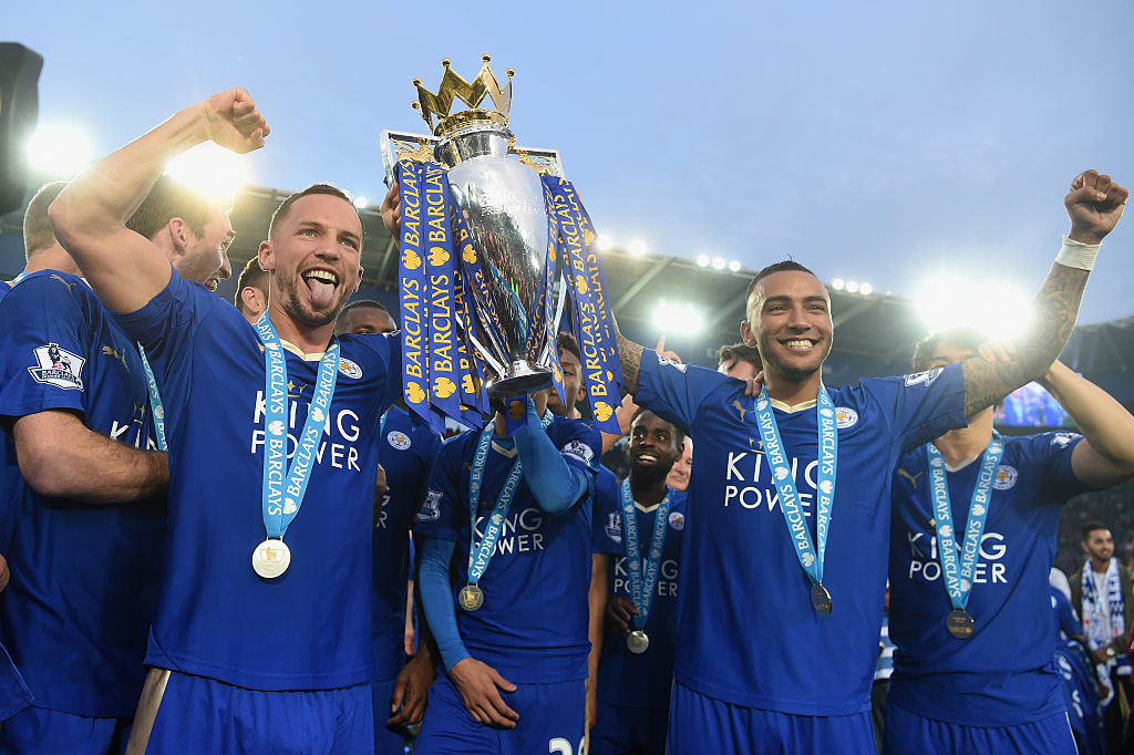 Danny Drinkwater and Danny Simpson of Leicester City poses with the Premier League Trophy as players and staffs celebrate the season champion after the Barclays Premier League match between Leicester City and Everton at The King Power Stadium on May 7, 2016 in Leicester, United Kingdom