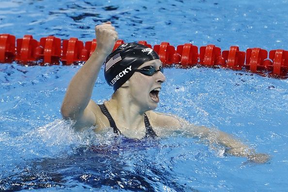 Katie Ledecky celebrates breaking a world record in the women&amp;#039;s 400m freestyle.