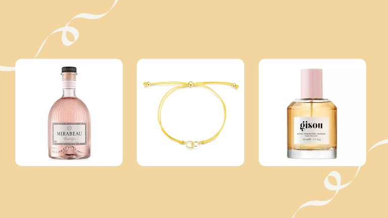 Three of w&h's best Christmas gifts for friends—Mirabeau rosé gin, Edge of Ember friendship bracelet and Gisou hair perfume—on a yellow background with festive decoration
