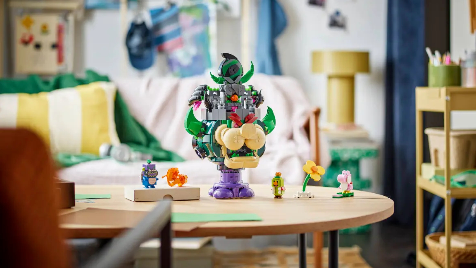 Lego Castle Bowser and figures sat on a wooden table in what seems to be a child&#039;s playroom