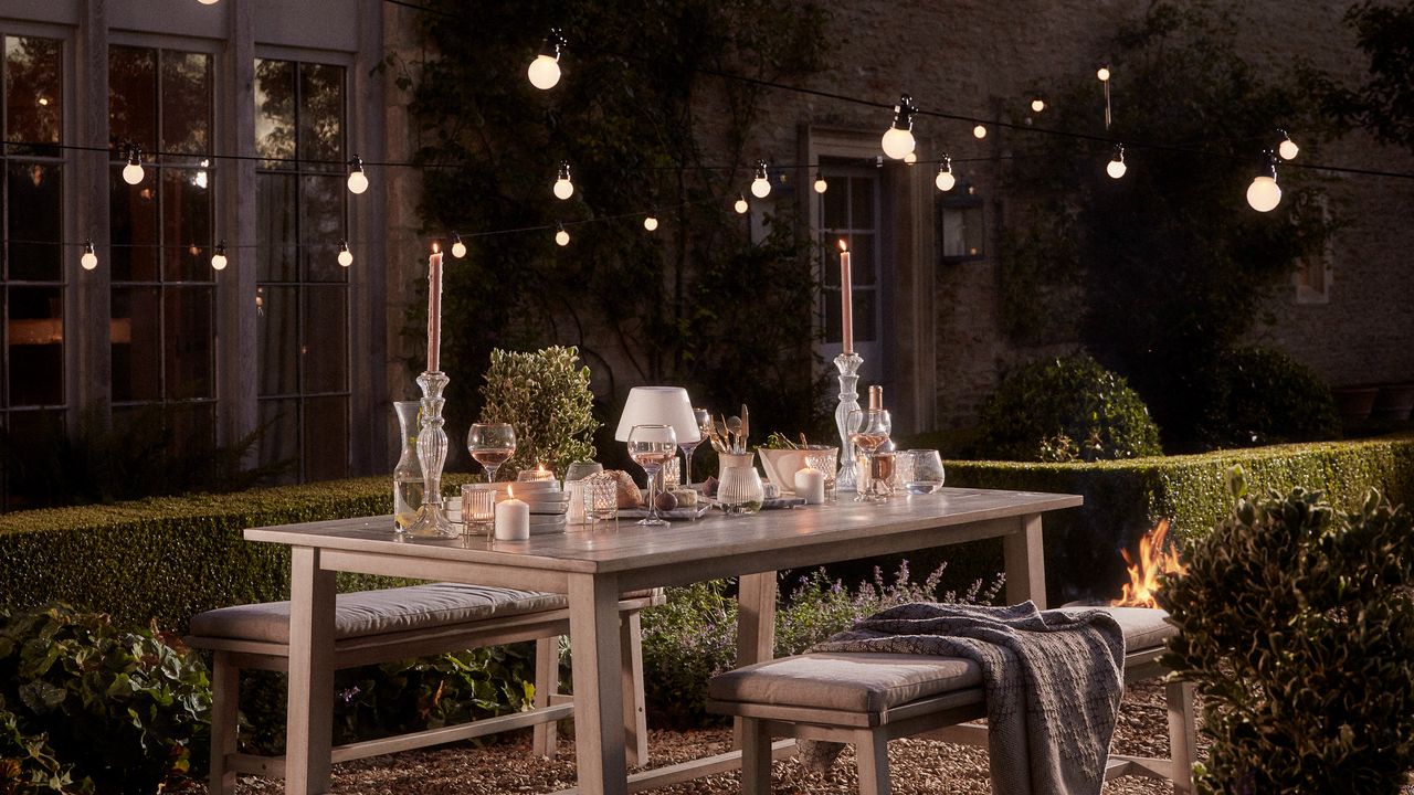 festoon light ideas: cox &amp; cox extendable globe festoon lights over outdoor bench