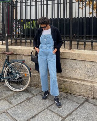 a woman in overalls