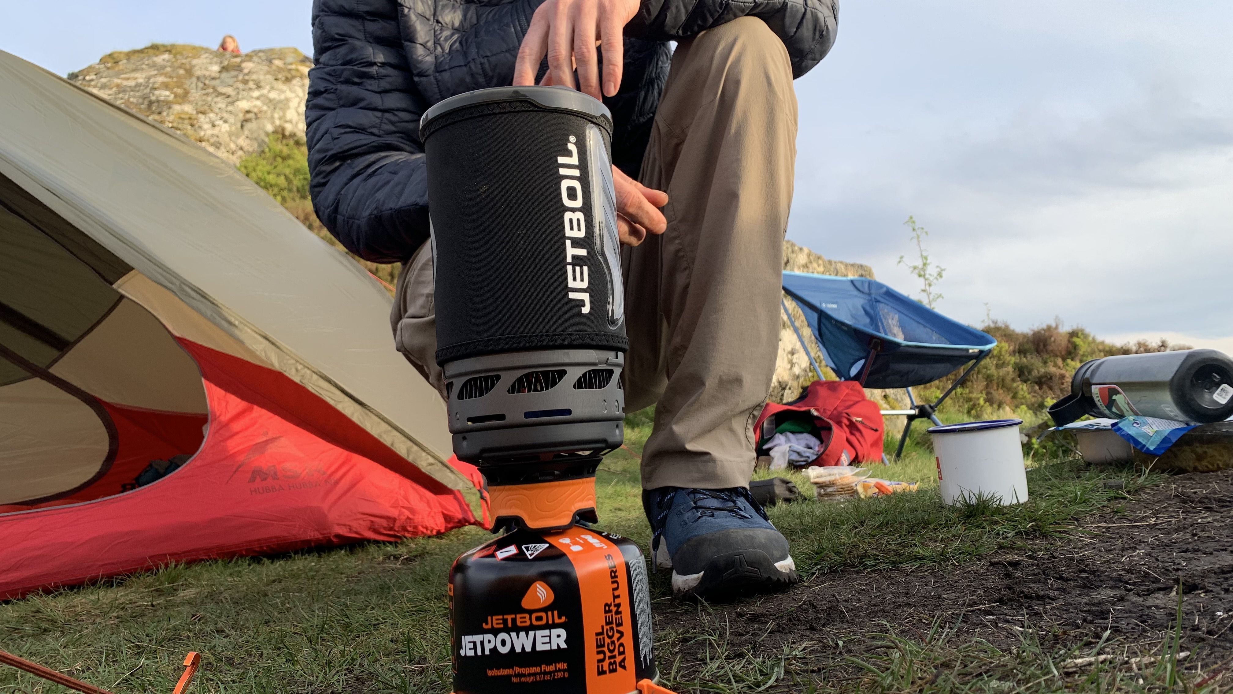 Close up of Jetboil Flash 1.0 with camper in the background