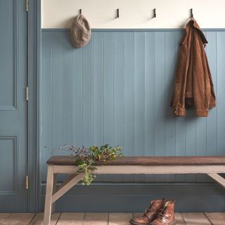 hallway with blue tongue and grooved panelled walls and cream walls