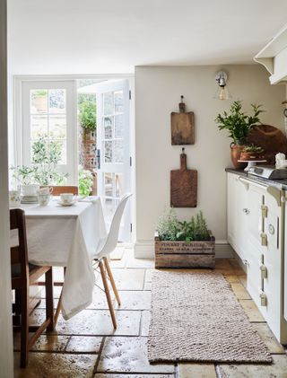 kitchen with white cabinets and french windows with herb box