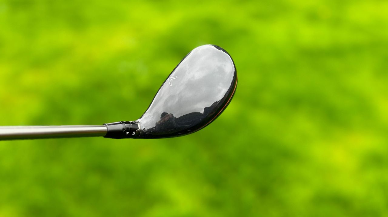 Callaway 2023 Big Bertha Hybrid and its glossy crown held aloft on the golf course