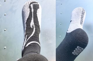 Osom Brand's Doug Hurley Orbit Space Socks feature the former astronaut's name and "Crew Dragon" as part of the design. Hurley wore the same style sock while in space.