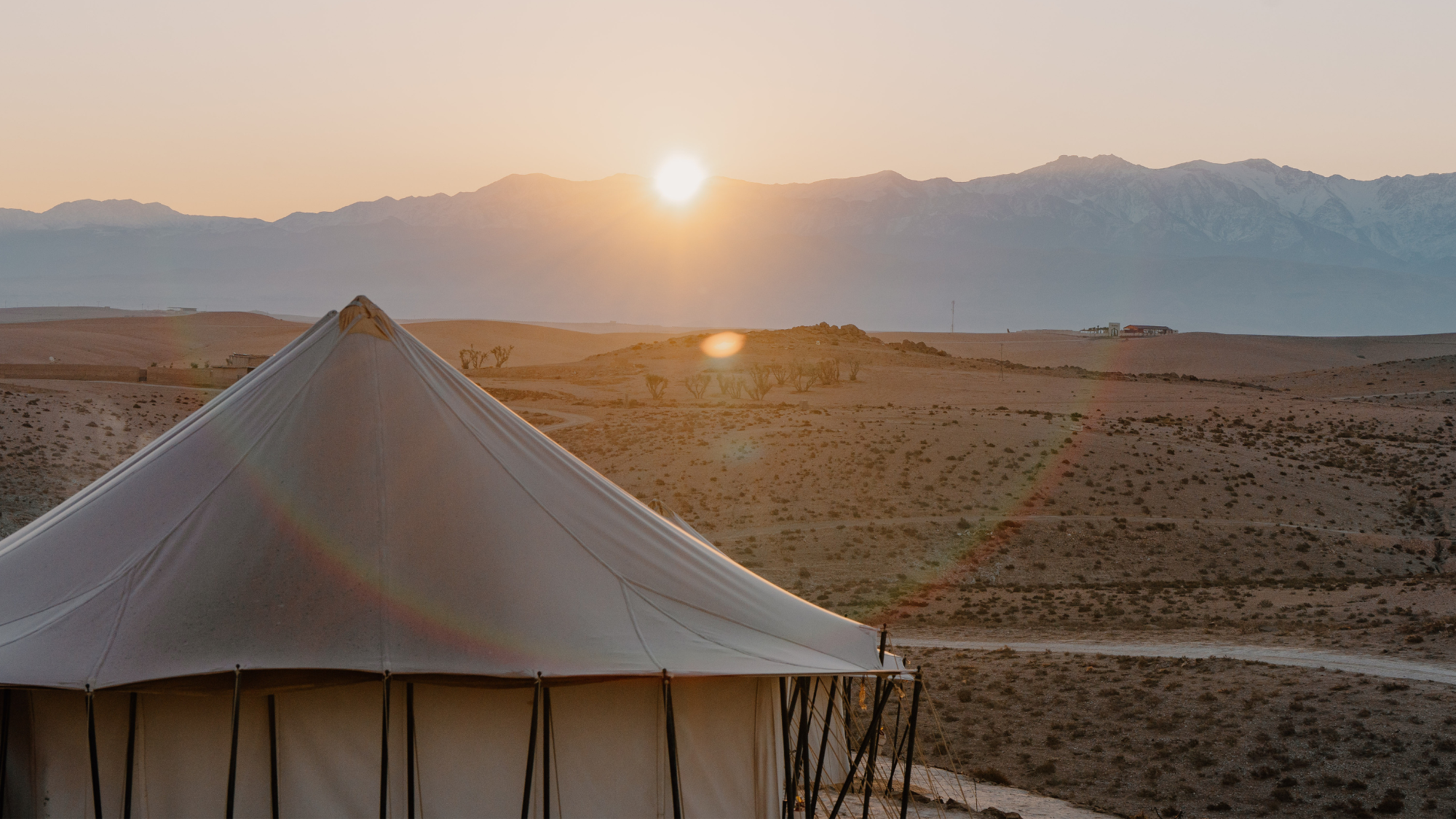 Agafay Desert and tent at sunset