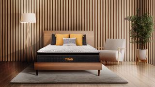 Titan Plus Elite Hybrid mattress on a wooden bedframe in a bedroom styled with wood-panelled walls