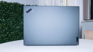 Lenovo ThinkPad X1 Carbon Gen 10 open facing away from camera displaying carbon texture