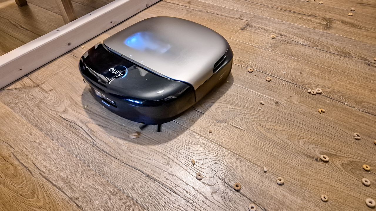 Eufy Omni S2 cleaning cheerios on wooden floor