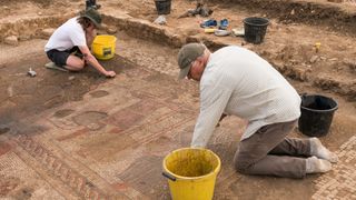 Figures emerge from the past as a scene from the Trojan War mosaic is uncovered.