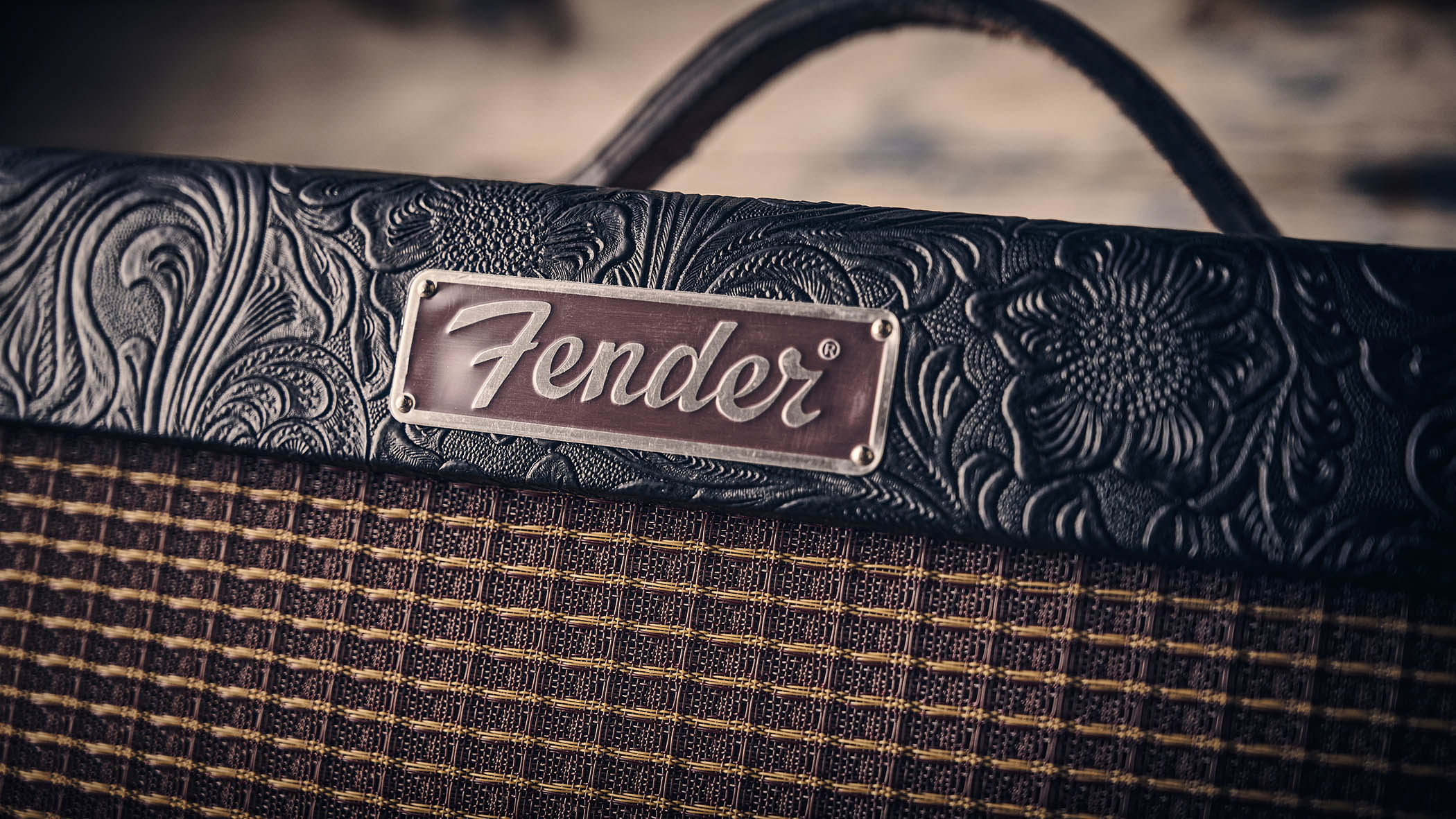 Fender Blues Junior IV 30th Anniversary: the classic combo is refinished with a touch of cowboy western flair, and is here photographed against some weathered floorboards in close-up