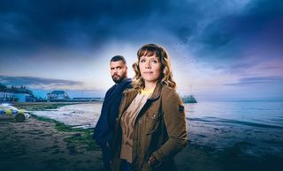 Kerry Godiman and Howard Charles posed in front of the backdrop of Whitstable Pearl.