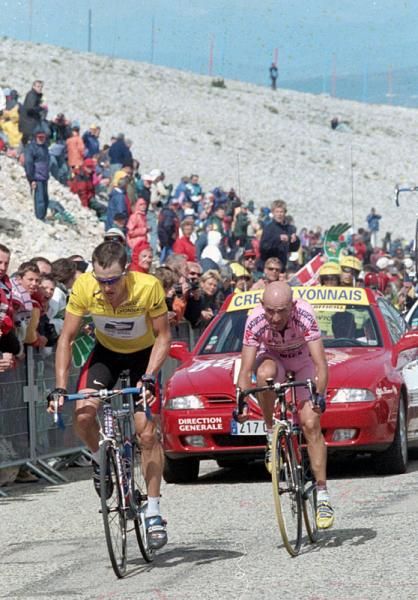 Race leader Lance Armstrong and Marco Pantani approach the Mont Ventoux summit finish in the 2000 Tour de France.