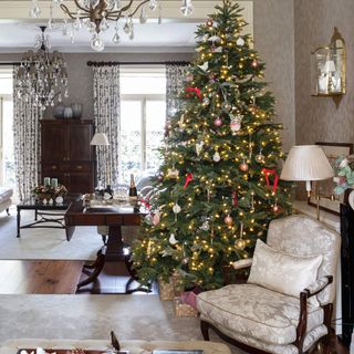 living room with christmas tree and wooden flooring