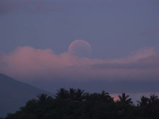 The setting red moon takes center stage in this photo of the total lunar eclipse of June 15, 2011 snapped by skywatcher David Matthews on Cagraray Island in Albay, Philippines.