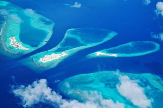 An aerial view of an archipelago of islands in the Maldives