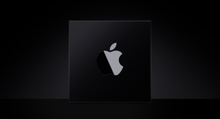 Chip with Apple logo on it on a black background.