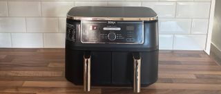 The Ninja Foodi Max Dual Zone Air Fryer AF400 on a kitchen countertop