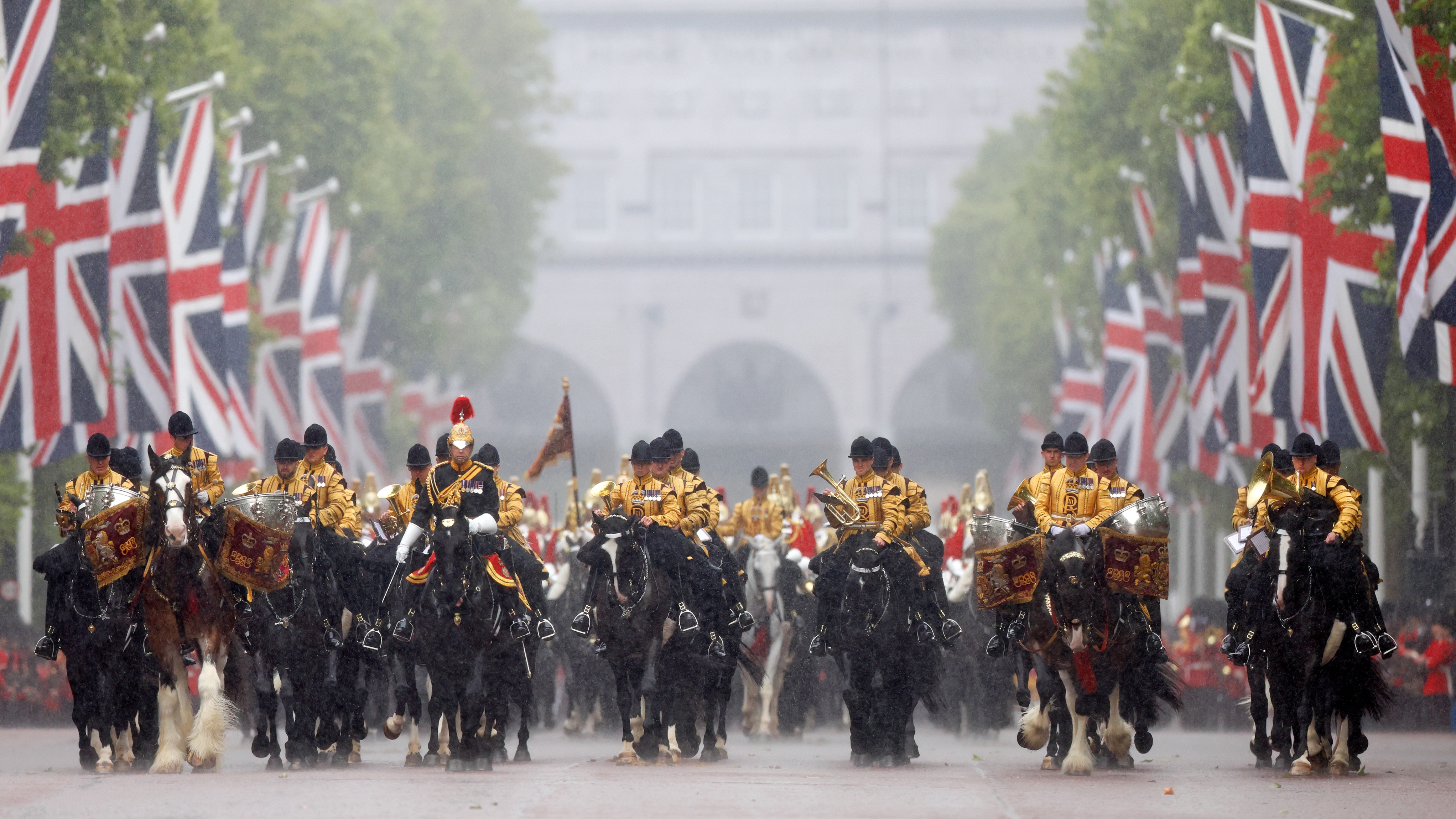 The Mounted Band of the Household Cavalry ride down The Mall, in a downpour, after attending Trooping the Colour on June 15, 2024