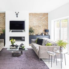 reconfiguring the layout living room large wall hung flatscreen tv grey sofa