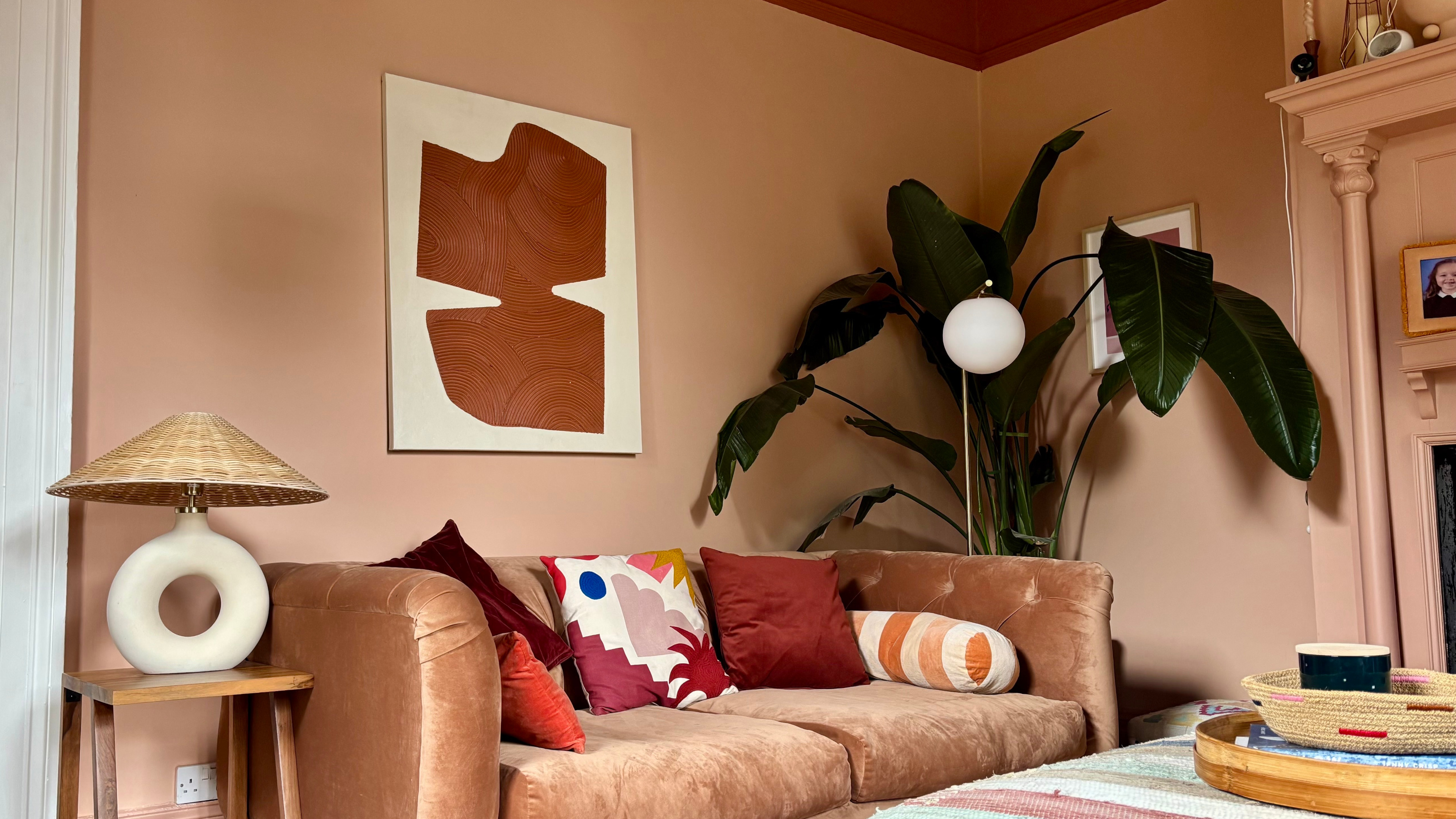 terracotta and pink living room with large bird of paradise 3200 x 1800