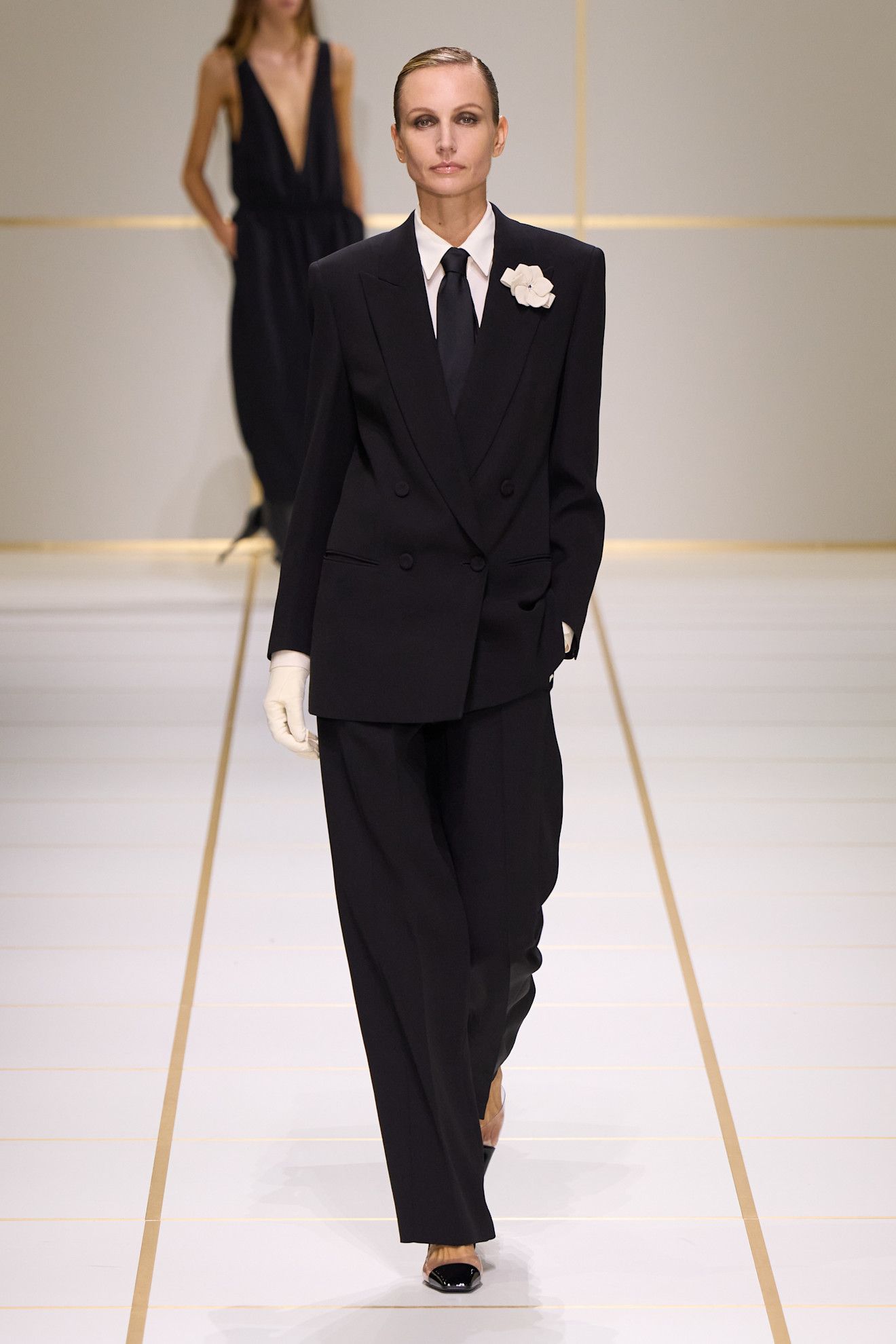 A model walks the giorgio armani s/s 27 runway.
