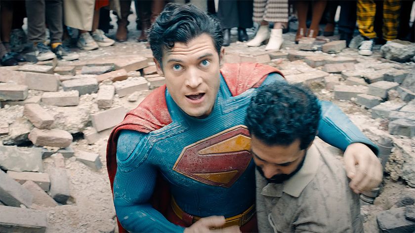 Superman being helped up by a pedestrian in 2025&#039;s Superman movie