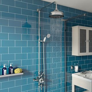 bathroom with blue tiles wall and shower
