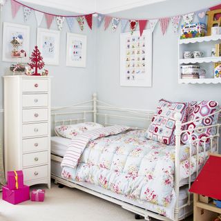 children bedroom with white drawer and pastels with pattern