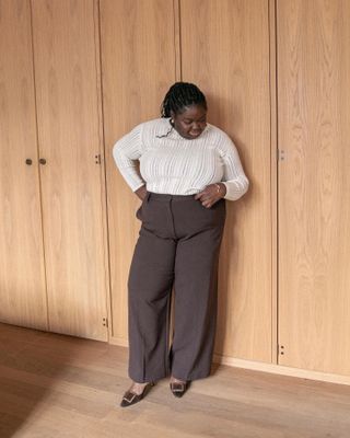 An image of influencer @abimarvel wearing a chic pair of work trousers