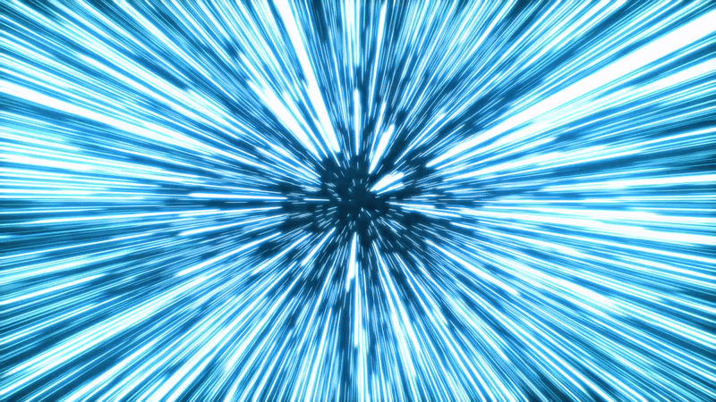 A short clip of lots of blue lines jetting past you like wind, portraying the speed of light as these light representations blur into contiguous lines.