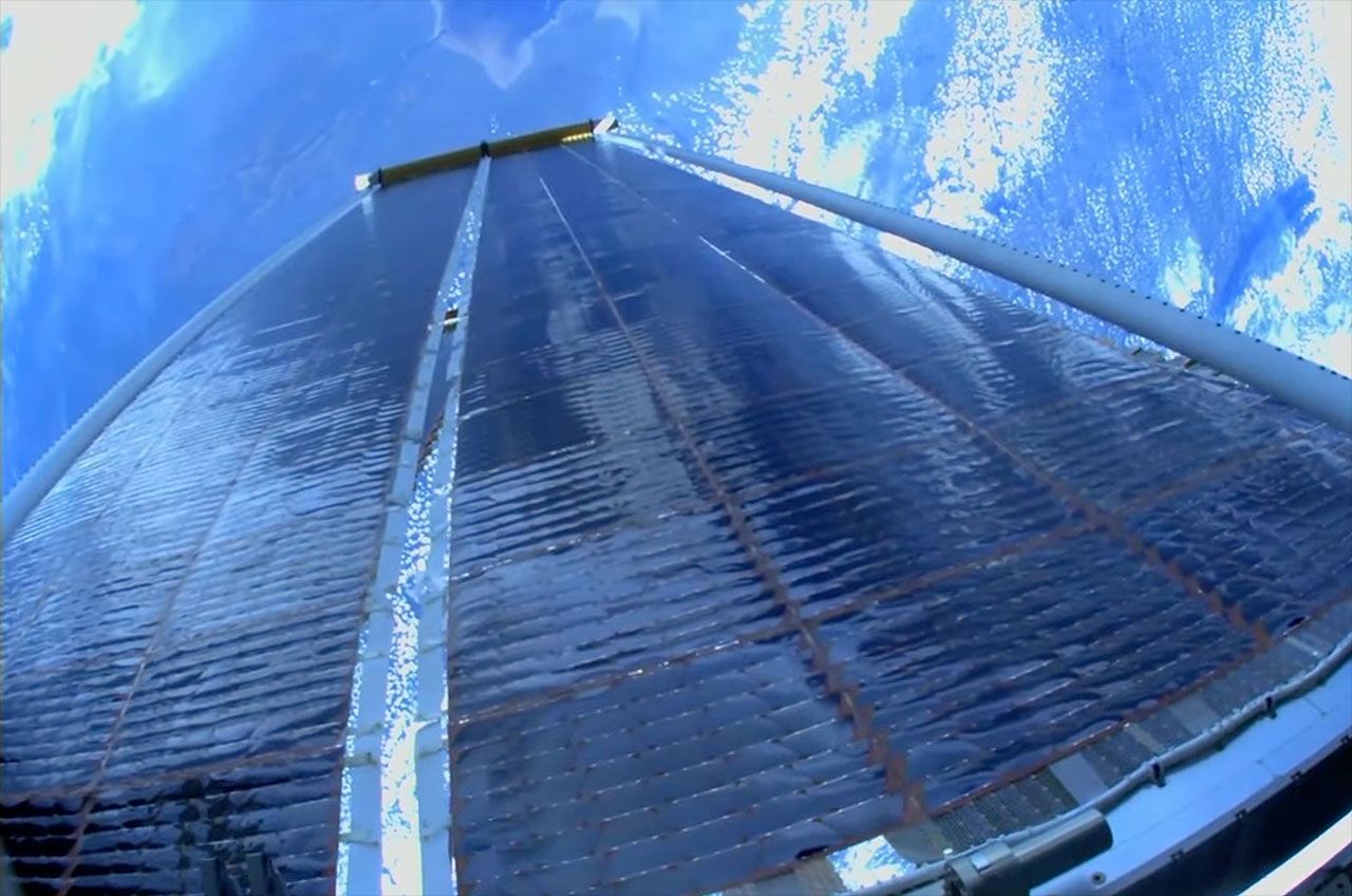 NASA astronauts deploy solar array on spacewalk outside space station ...