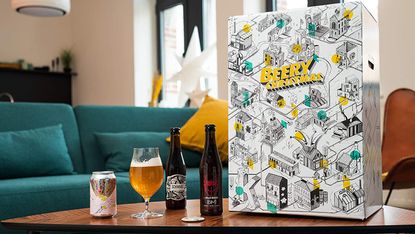 Best advent calendar for beer lovers: Beer Hawk "Beery Christmas" Craft Beer Advent Calendar on table with snacks and beers