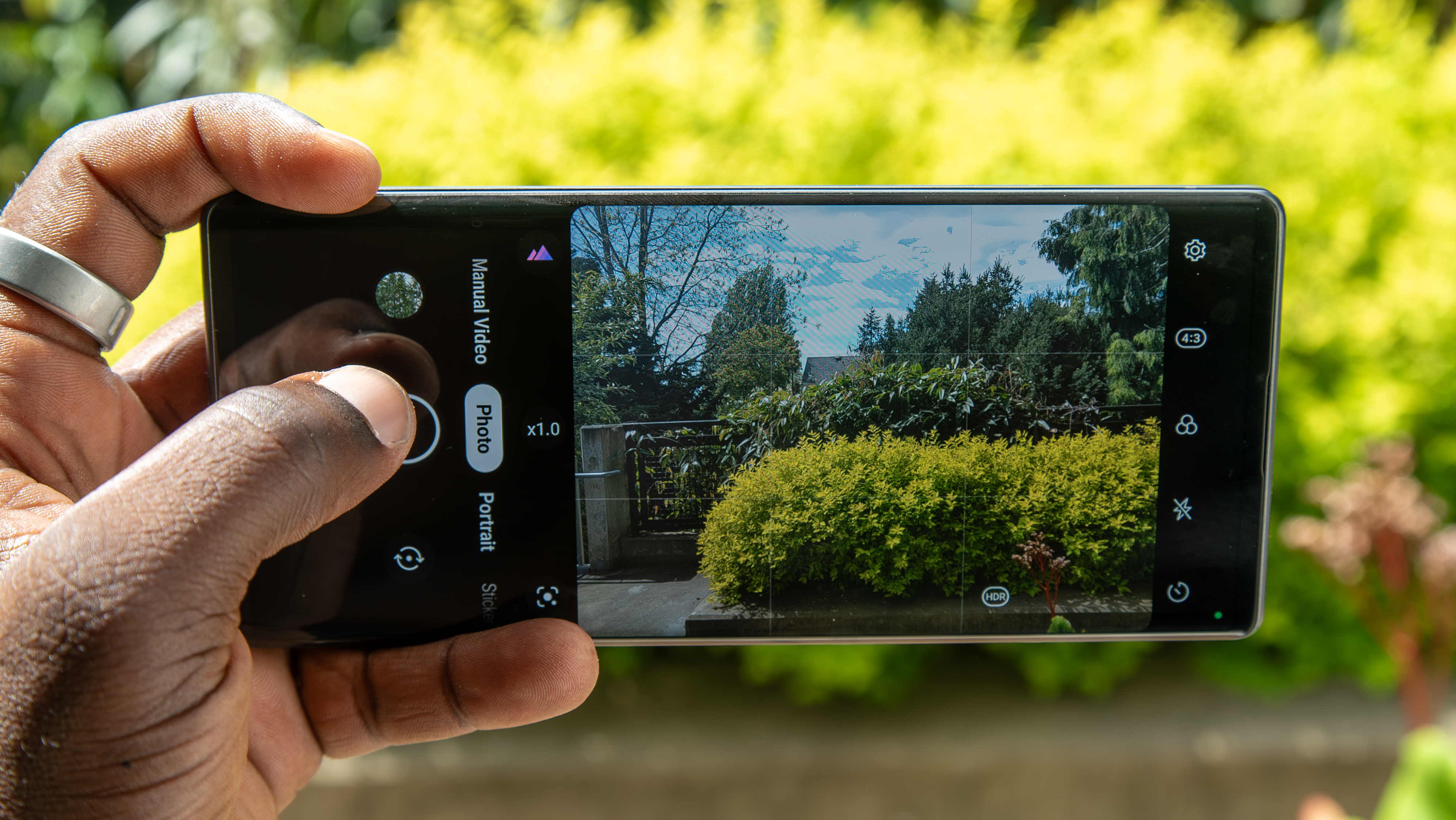 The LG Wing camera taking a photo of a bush