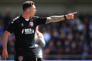 Fleetwood Town Manager, Scott Brown instructs his players during the Sky Bet League One match between Fleetwood Town and Ipswich Town at Highbury Stadium on May 07, 2023 in Fleetwood, England.
