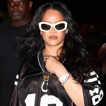 Rihanna styled the sports jersey trend with Nike sneakers and a Louis Vuitton Speedy Bag in NYC