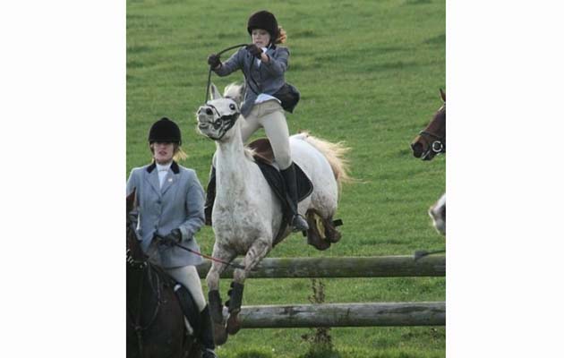 &ldquo;This is me out hunting a few years ago when my pony got a bit too enthusiastic. Although we had a lead over the jump, she stayed behind and took off the same time as them, launching me into mid-air. It wasn&rsquo;t a graceful landing, with my nose touching her ears, but thankfully I recovered and trotted off into the woods to recover! It was very embarrassing!&rdquo; &mdash; Rebecca Clegg